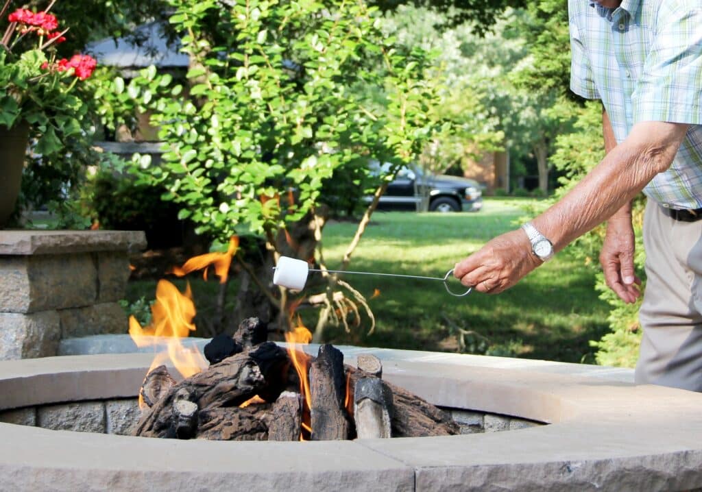 Tips To Host Summer Celebrations at Home 1 Elderly man in the backyard enjoying the summer celebration party