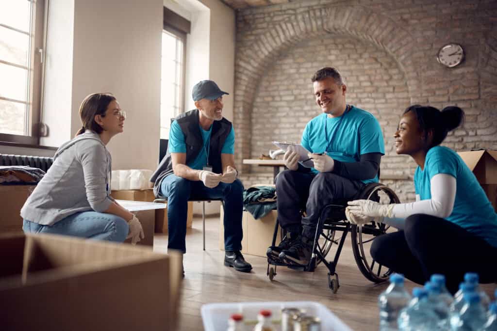 group of happy volunteers having a meeting while c 2023 11 27 05 30 02 utc